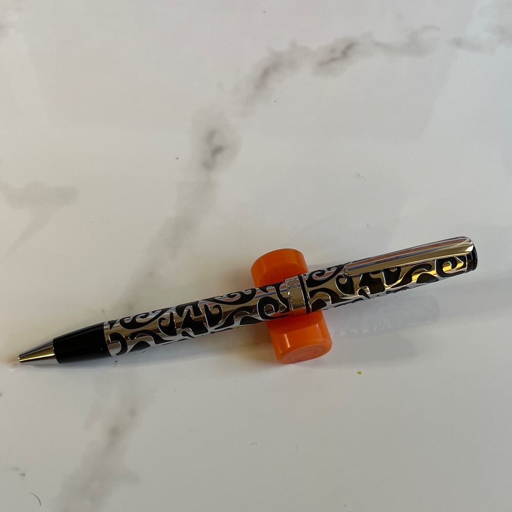 TOUS Ballpoint Pen. TOUS engraved on center ring.